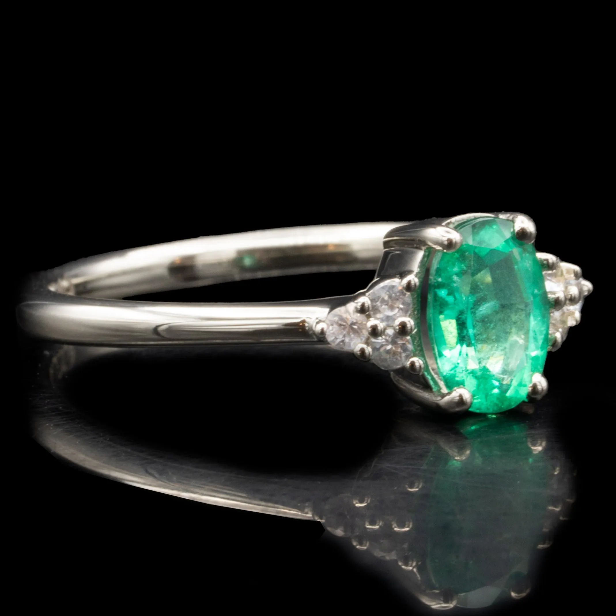 Emerald Engagement Ring With Side Stones
